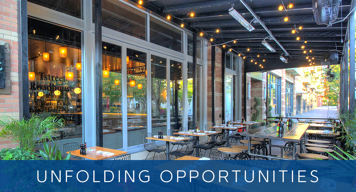 UNFOLDING OPPORTUNITIES - Restaurant patio exterior with aluminum bifold doors and windows